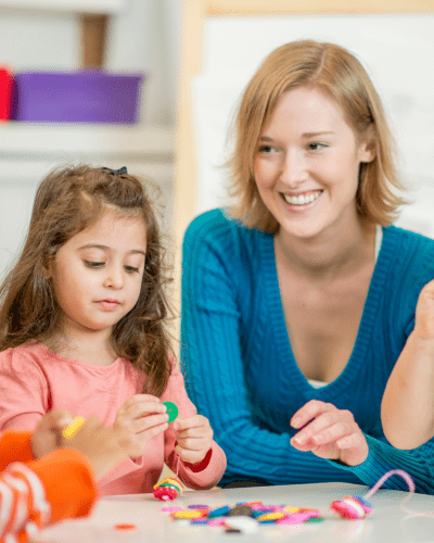 Occupational Therapist Beading with Children